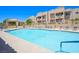 Sparkling community pool with ample lounge seating and desert landscaping at 2240 Highpointe Dr # 203, Laughlin, NV 89029