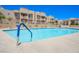 Sparkling community pool with ample lounge seating and desert landscaping at 2240 Highpointe Dr # 203, Laughlin, NV 89029