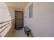 Inviting front entrance with security door, access ramp, and comfortable shoe bench at 2240 Highpointe Dr # 203, Laughlin, NV 89029
