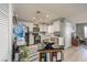 Well-lit kitchen with white cabinets, black appliances, and butcher block island enhancing functionality and style at 2240 Highpointe Dr # 203, Laughlin, NV 89029