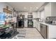 Spacious kitchen featuring white cabinets, black appliances, and ample counter space, ideal for cooking and entertaining at 2240 Highpointe Dr # 203, Laughlin, NV 89029