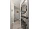 Efficient laundry room with stacked washer and dryer, and a peek into the adjacent well-lit bathroom at 2240 Highpointe Dr # 203, Laughlin, NV 89029