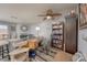 A multi-purpose living area with workstation, comfortable seating, and a ceiling fan at 2240 Highpointe Dr # 203, Laughlin, NV 89029