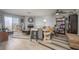Bright living room featuring luxury vinyl plank flooring and a dedicated workspace and living area at 2240 Highpointe Dr # 203, Laughlin, NV 89029