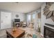 Cozy living room area featuring fireplace, sliding glass doors, and luxury vinyl plank flooring at 2240 Highpointe Dr # 203, Laughlin, NV 89029