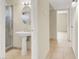 Bathroom featuring tile floors, a pedestal sink, and a glass-enclosed shower at 2257 Colebrook St, Las Vegas, NV 89115