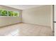 A bright bedroom featuring tile flooring and a large window at 2257 Colebrook St, Las Vegas, NV 89115