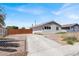 Charming single-story home featuring a well-maintained yard, driveway, and fenced perimeter at 2257 Colebrook St, Las Vegas, NV 89115