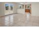 Sunlit living room featuring tile floors, French doors, and an open view to the kitchen at 2257 Colebrook St, Las Vegas, NV 89115