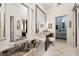 Modern bathroom featuring stylish vanity, mirrors, and lighting, plus a soaking tub at 2323 Pinto Ln, Las Vegas, NV 89107