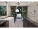 Spa-like bathroom features a soaking tub, walk-in shower, and views of the serene outdoor space at 2323 Pinto Ln, Las Vegas, NV 89107