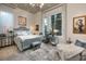 Serene bedroom with soft colors, decorative accents, and a large window for natural light at 2323 Pinto Ln, Las Vegas, NV 89107