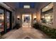 Elegant entrance featuring manicured greenery and modern lighting fixtures at 2323 Pinto Ln, Las Vegas, NV 89107