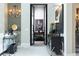 Elegant entryway with decorative chandelier, stylish console table, and unique artistic accents at 2323 Pinto Ln, Las Vegas, NV 89107