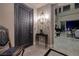 A grand entryway with decorative door, tiled floors, chandelier and an open view to the living spaces at 2323 Pinto Ln, Las Vegas, NV 89107