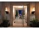Elegant home entryway with fire sconces and an open view to the living area at 2323 Pinto Ln, Las Vegas, NV 89107