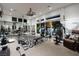 Spacious home gym equipped with weight machines, cardio equipment, and mirrored walls for fitness at 2323 Pinto Ln, Las Vegas, NV 89107