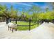 Equestrian estate featuring a horse paddock with lush greenery and ample space for animals to roam at 2323 Pinto Ln, Las Vegas, NV 89107