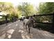 Equestrian estate featuring a horse paddock and a stone-paved path for animals to roam at 2323 Pinto Ln, Las Vegas, NV 89107