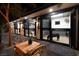 Equestrian property at night, showcasing stables with well-lit stalls and a cozy atmosphere at 2323 Pinto Ln, Las Vegas, NV 89107