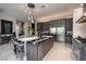Gourmet kitchen features a large island, stylish bar stools, and stainless steel appliances at 2323 Pinto Ln, Las Vegas, NV 89107