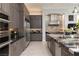 Modern kitchen featuring sleek wood cabinets, stainless steel appliances, and granite countertops at 2323 Pinto Ln, Las Vegas, NV 89107