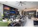 Spacious living room with modern media center, open layout, and adjacent kitchen at 2323 Pinto Ln, Las Vegas, NV 89107