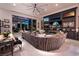 Entertainment-ready living room with multiple screens, comfortable seating, and access to the outdoor patio at 2323 Pinto Ln, Las Vegas, NV 89107