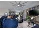 A stylish living room with comfortable seating, elegant decor, and a large ceiling fan at 2323 Pinto Ln, Las Vegas, NV 89107