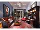 A cozy living room features stylish furniture, decor, large windows, and a decorative chandelier at 2323 Pinto Ln, Las Vegas, NV 89107