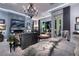 Luxurious main bedroom with fireplace, chandelier, sitting area, and plush textures throughout at 2323 Pinto Ln, Las Vegas, NV 89107