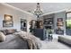 Expansive main bedroom boasts a fireplace, chandelier, and outdoor views, plus a lavish chaise lounge at 2323 Pinto Ln, Las Vegas, NV 89107