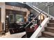 An elegant office area features a built-in bookcase under stairs, decorative lighting, and views of the outdoors at 2323 Pinto Ln, Las Vegas, NV 89107