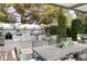 Outdoor kitchen and dining area featuring a built-in grill, ample counter space, and comfortable seating at 2323 Pinto Ln, Las Vegas, NV 89107
