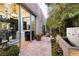 Private outdoor space features a water feature, lush landscaping, and seamless access to indoor living at 2323 Pinto Ln, Las Vegas, NV 89107