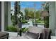 Inviting sitting area features views of a lush landscaped yard and a tranquil water feature at 2323 Pinto Ln, Las Vegas, NV 89107