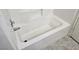 Clean white bathtub with tile surround and updated faucet at 2615 W Gary Ave # 1085, Las Vegas, NV 89123