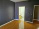 Bedroom with hardwood flooring and a view to the en-suite bathroom at 2615 W Gary Ave # 1085, Las Vegas, NV 89123