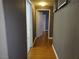 Hallway with wood floors and multiple doors leading to rooms at 2615 W Gary Ave # 1085, Las Vegas, NV 89123