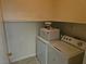 Functional laundry room with washer, dryer, and convenient overhead shelving at 2615 W Gary Ave # 1085, Las Vegas, NV 89123