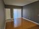 Spacious living room features hardwood floors and sliding glass doors for natural light at 2615 W Gary Ave # 1085, Las Vegas, NV 89123