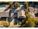 An elevated view of a neighborhood highlighting manicured lawns, a pool, a covered patio, and mature trees at 2617 Mason Ave, Las Vegas, NV 89102