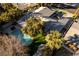 An aerial view showcases a home with a pristine backyard, a private pool, and a meticulously landscaped yard at 2617 Mason Ave, Las Vegas, NV 89102