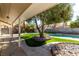 Lush backyard with a sparkling pool, artificial grass, mature trees, and a charming patio area, perfect for outdoor enjoyment at 2617 Mason Ave, Las Vegas, NV 89102