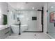 This bathroom features a soaking tub, walk-in shower with glass enclosure and subway tile at 2617 Mason Ave, Las Vegas, NV 89102