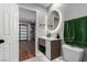 Stylish bathroom features a modern vanity, illuminated round mirror, and a fresh, clean design at 2617 Mason Ave, Las Vegas, NV 89102