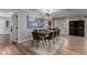 Elegant dining room with seating for eight, a glass table, and a built-in wine rack at 2617 Mason Ave, Las Vegas, NV 89102