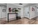 Light and bright entryway featuring wood flooring, modern decor, and white trim at 2617 Mason Ave, Las Vegas, NV 89102