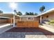 Inviting single-story home with carport, desert landscaping, and brick-paved driveway at 2617 Mason Ave, Las Vegas, NV 89102