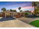 Charming single-story home with desert landscaping, palm trees, and a brick-paved driveway at 2617 Mason Ave, Las Vegas, NV 89102